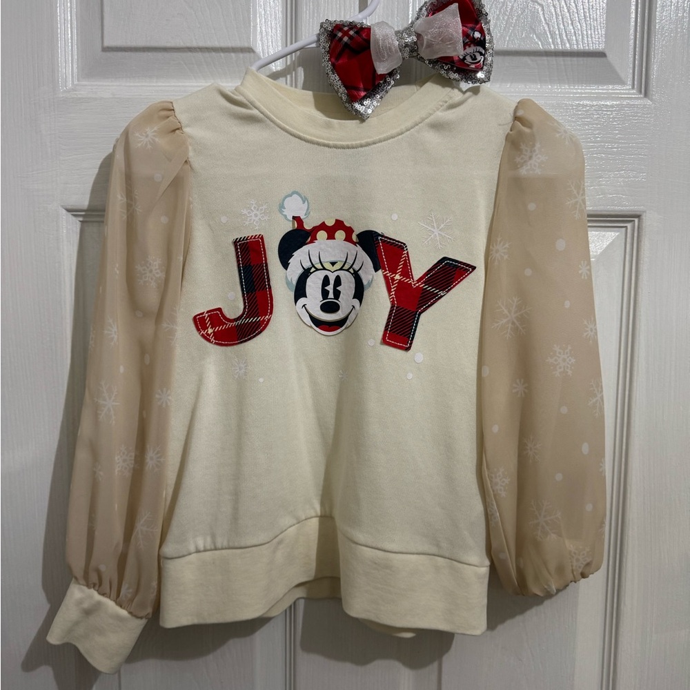 Disney Kids Cream Joy Shirt with Sheer Sleeves and matching bow included.